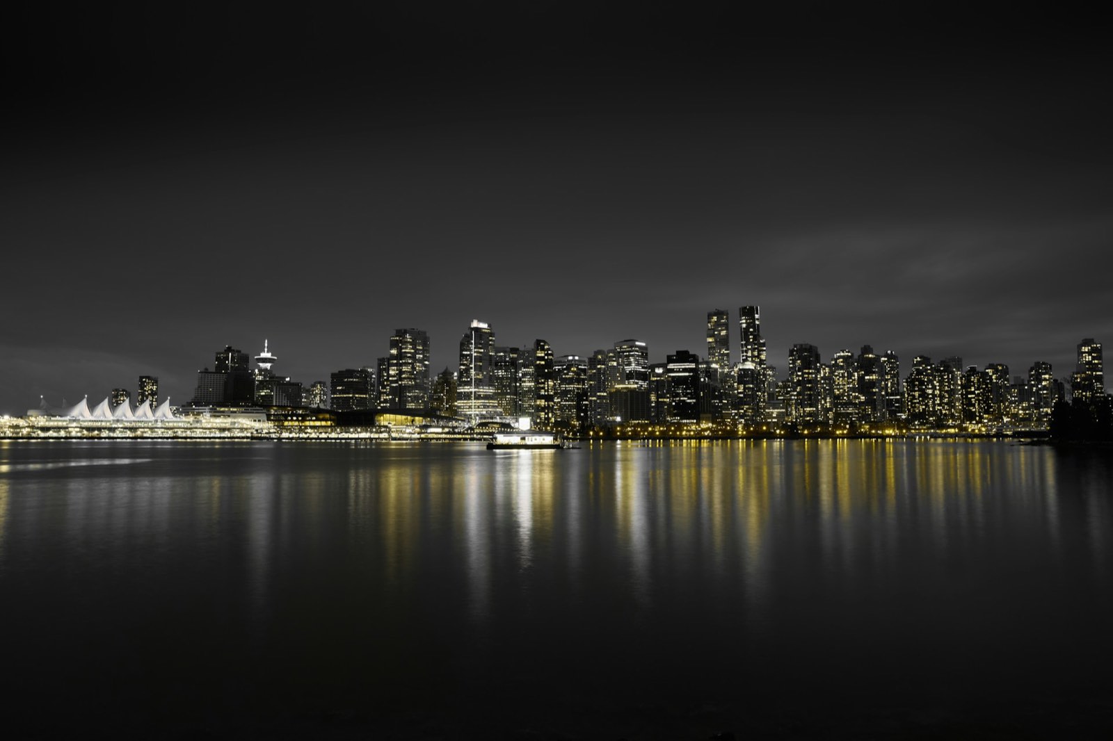 A downtown skyline at night across the water
